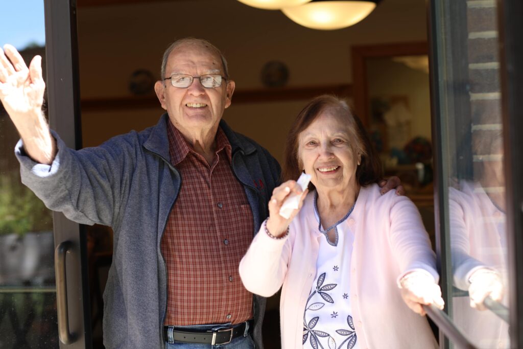 Residents waving happily