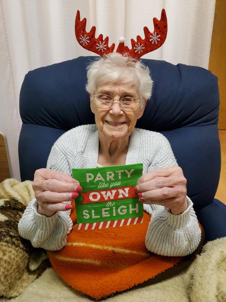 Happy elderly adult receiving christmas gifts