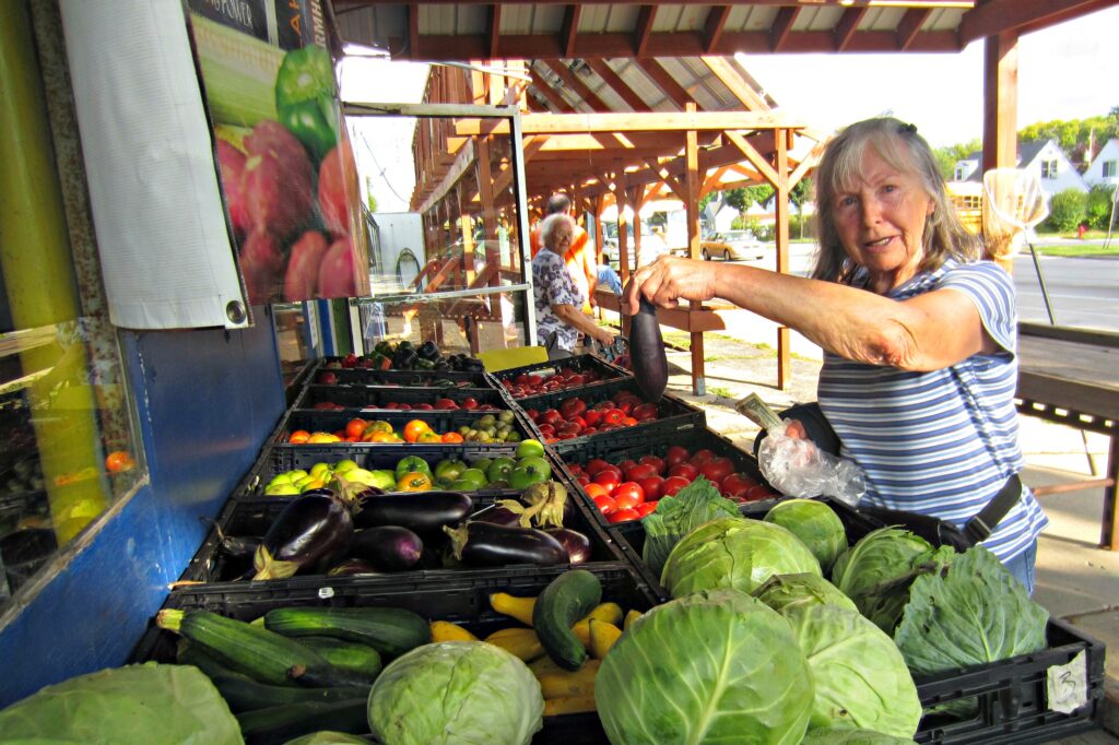 Older adult shopping for produce