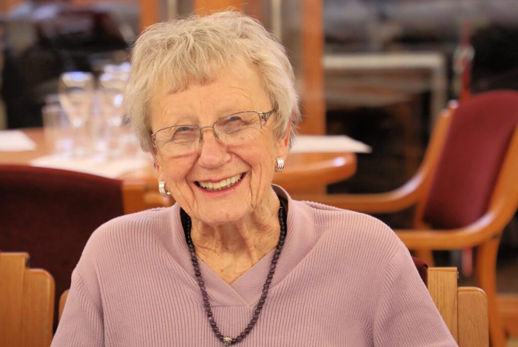 older woman smiling at camera
