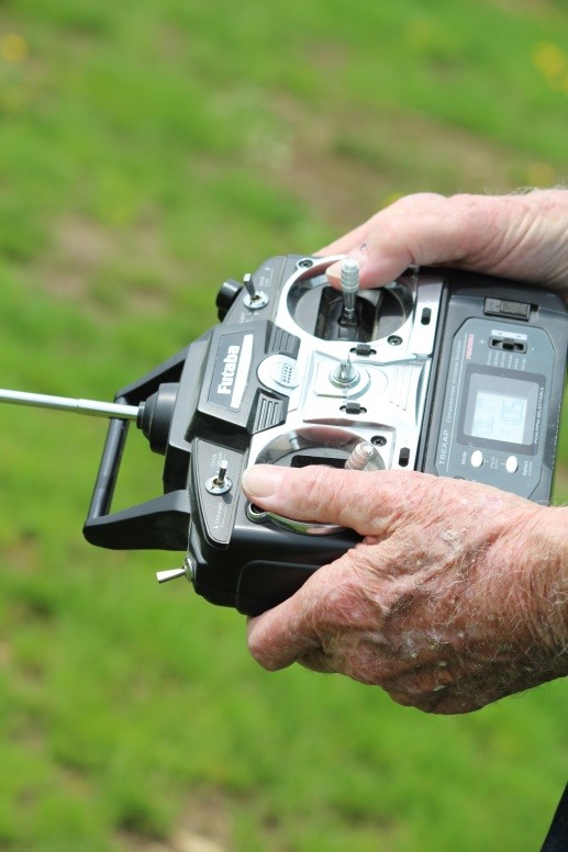 Chuck Hocking uses hand-eye coordination to fly his RC planes using a handheld controller