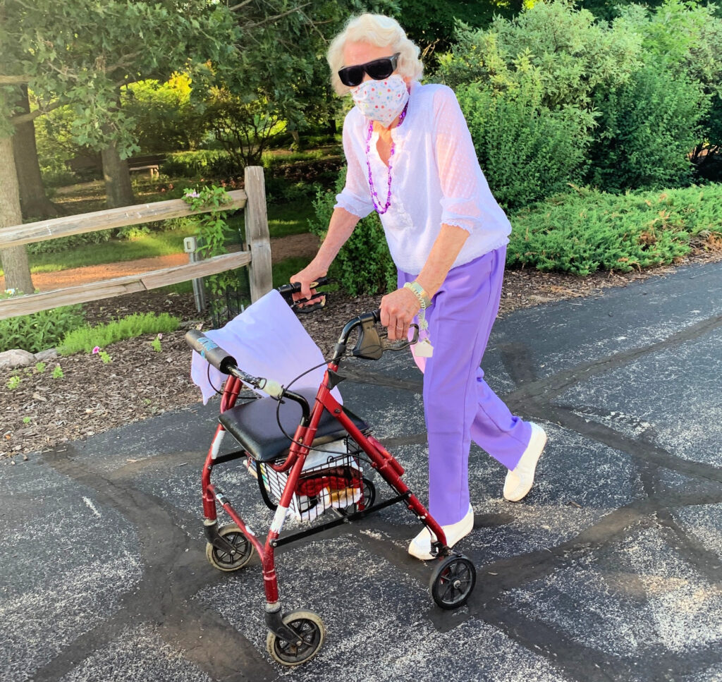 Elderly woman enjoying the outdoors wearing sunglasses
