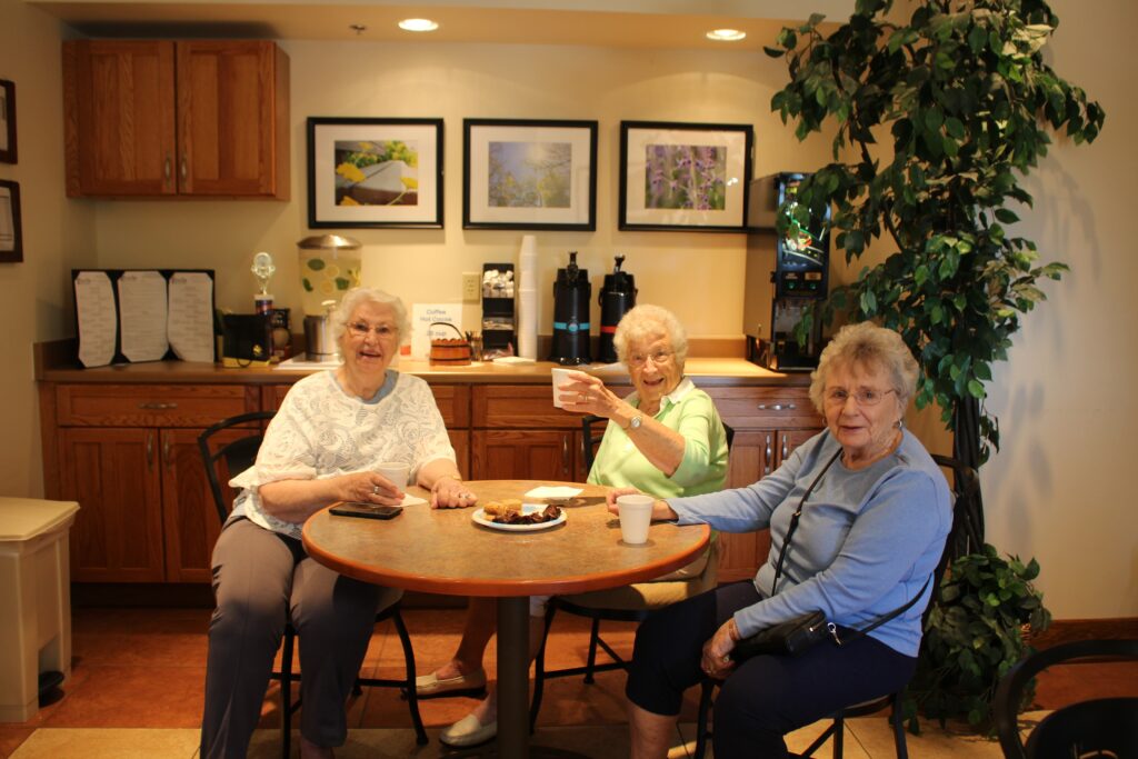 older adult women enjoy drinks together