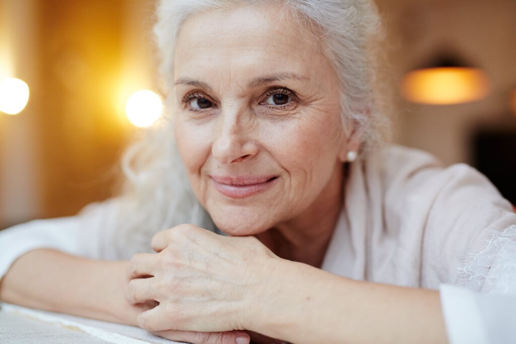 older woman smiling at camera