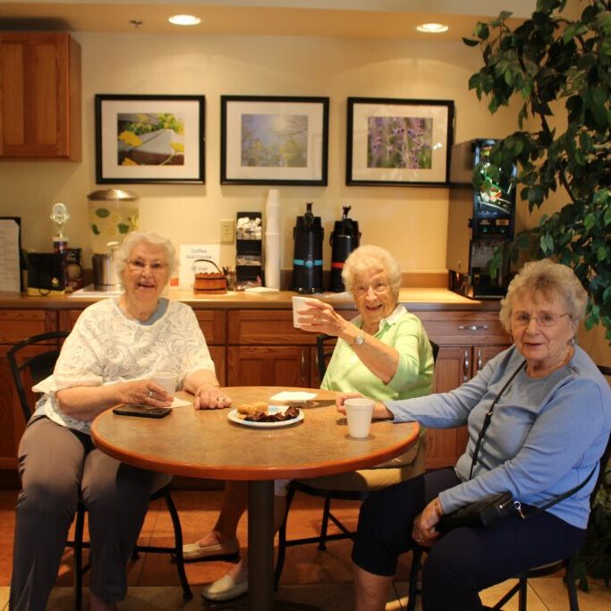 older adult women enjoy drinks together